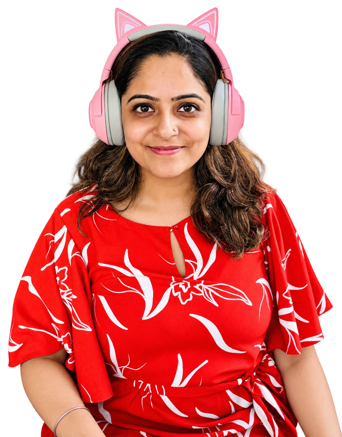 Surbhi Kanwar smiling in pink headphones and a floral shirt